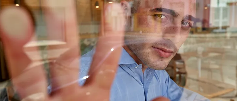 businessman-touching-transparant-glass-windows-office-confident-businessman-touching-glass